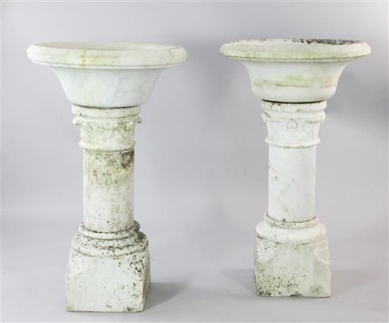 A pair of marble gardens urns, approx. H.3ft 4in.